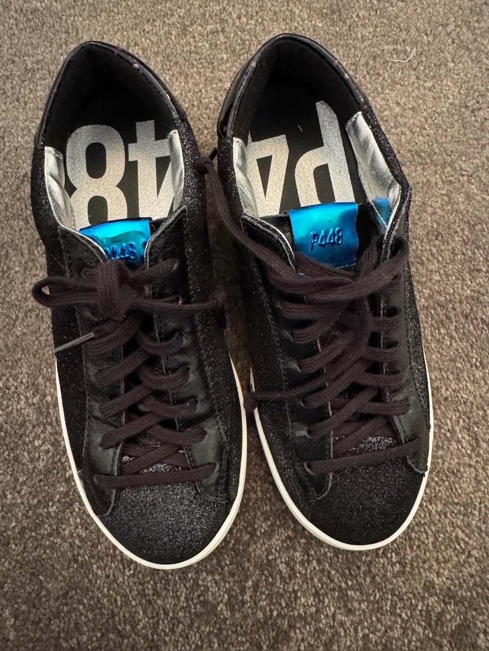 P448 Black Low-Top Sneakers with Blue Tongue Accent